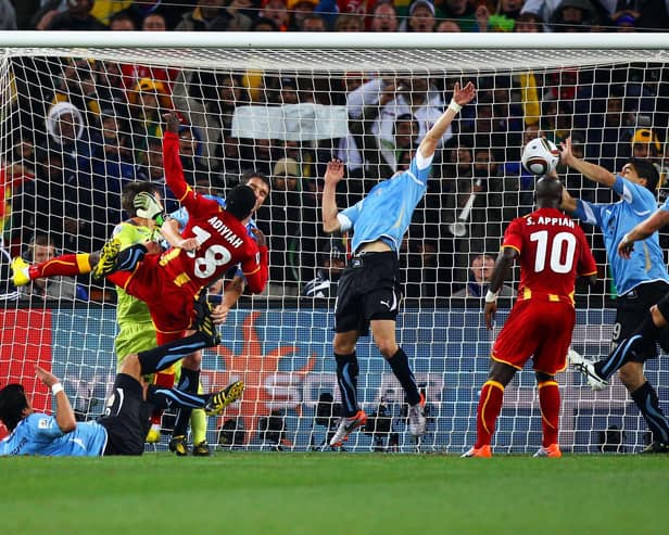 Luis Suarez of Uruguay handles the ball on the goal line, for which he is sent off, during the 2010 FIFA World Cup South Africa Quarter Final match between Uruguay and Ghana at the Soccer City stadium on July 2, 2010 in Johannesburg, South Africa.