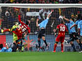 Luis Suarez of Uruguay handles the ball on the goal line, for which he is sent off, during the 2010 FIFA World Cup South Africa Quarter Final match between Uruguay and Ghana at the Soccer City stadium on July 2, 2010 in Johannesburg, South Africa.