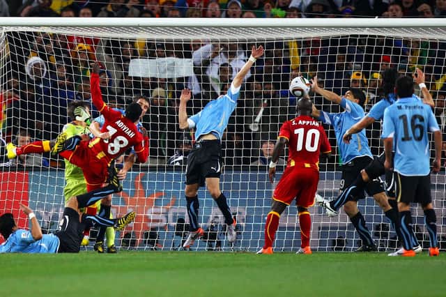 Luis Suarez of Uruguay handles the ball on the goal line, for which he is sent off, during the 2010 FIFA World Cup South Africa Quarter Final match between Uruguay and Ghana at the Soccer City stadium on July 2, 2010 in Johannesburg, South Africa.