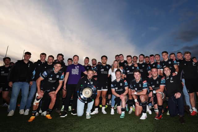 Warriors players with the Scottish-Italian shield.