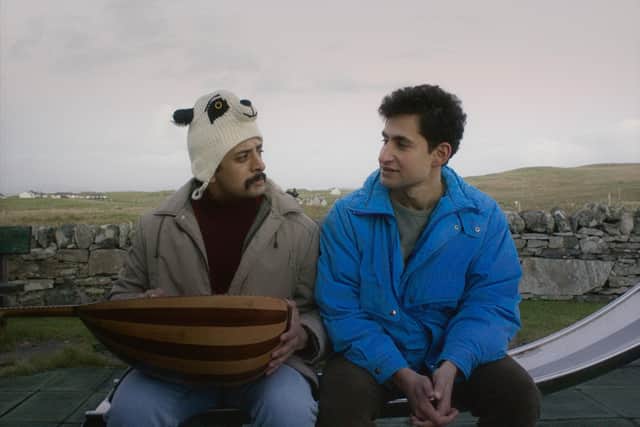 Vikash Bhai as Farhad and Amir El-Masry as Omar in Limbo, Sharrock's feature film set on a mythical Hebridean island. Farhad is holding Omar's oud, the traditional Syrian musical instrument he brought with him on his journey.