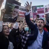 A protester tears up his Iranian passport during a protest against Iran and the death of Iranian Mahsa Amini  in Istanbul, Turkey.