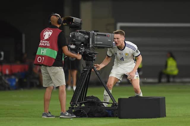 Scotland's Scott McTominay celebrates scoring a goal against Spain that was later annulled following a VAR check. (Photo by JORGE GUERRERO/AFP via Getty Images)