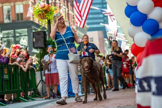 Dogs wearing patriotic costumes make their way past fans and judges during the Patriotic Pooch Parade in Boston, Massachusetts. Image: Getty Images