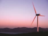 Revolutionary moves: a wind turbine with the Isle of Arran as a backdrop. Smart meters can play an integral part in integrating the intermittent nature of renewable energy sources into our power mix