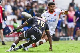 Edinburgh's Jake Henry on the attack against Sharks full-back Aphelele Fassi during the EPCR Challenge Cup quarter-final at Kings Park, Durban. (Photo: Steve Haag Sports/INPHO/Shutterstock)