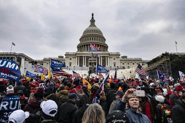 Supporters of Donald Trump storm the US Capitol after he told them to go there in a rally near the White House (Picture: Samuel Corum/Getty Images)