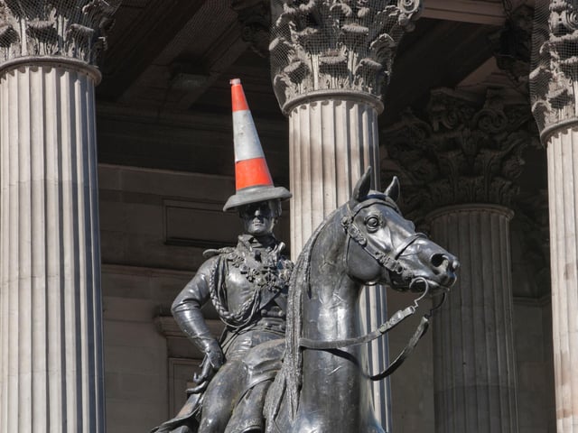 The statue depicts Arthur Wellesley (1st Duke of Wellington) and can be found outside Glasgow’s Gallery of Modern Art. It is famous for being capped with a traffic cone in a move said to reflect the local Glaswegian humour - this has been done since at least the 1980s.