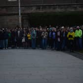 Darya Tsymbalyuk, dressed in the colours of the Ukrainian flag, addresses students at a vigil in support of Ukraine in St Andrews on Monday.