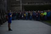 Darya Tsymbalyuk, dressed in the colours of the Ukrainian flag, addresses students at a vigil in support of Ukraine in St Andrews on Monday.