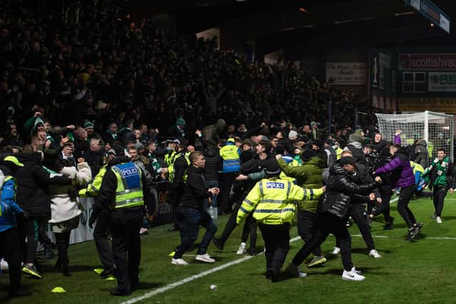 Celtic fans spill on to the pitch after Anthony Ralston's 97th minute winner in Dingwall (Photo by Craig Foy / SNS Group)