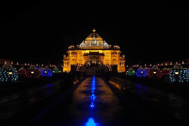 The Akshardham Hindu temple decorated with oil earthen lamps is pictured on the eve of 'Diwali' festival in Gandhinagar, some 30 km from Ahmedabad on November 3, 2021.  (Image credit: Sam Panthaky/AFP via Getty Images)