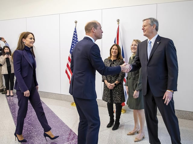 William and Kate are greeted by Massachusetts Gov. Charlie Baker, right, and first lady Lauren Baker, second right, as they arrive at Boston Logan International Airport.