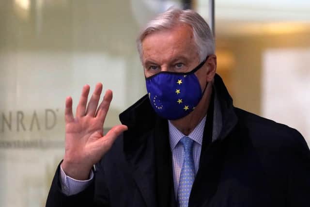 EU chief Brexit negotiator Michel Barnier, wearing an EU flag-themed facemask due to the novel coronavirus pandemic, leaves a hotel in London. Picture: Tolga Akmen/AFP via Getty Images