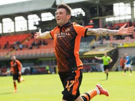 Jamie Robson celebrates after scoring the only goal of the game for Dundee United against Rangers at Tannadice. (Photo by Ross Parker / SNS Group)