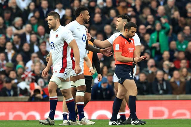 Charlie Ewels of England leaves the field after being shown a red card within the first minute of a match against Ireland.