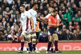 Charlie Ewels of England leaves the field after being shown a red card within the first minute of a match against Ireland.