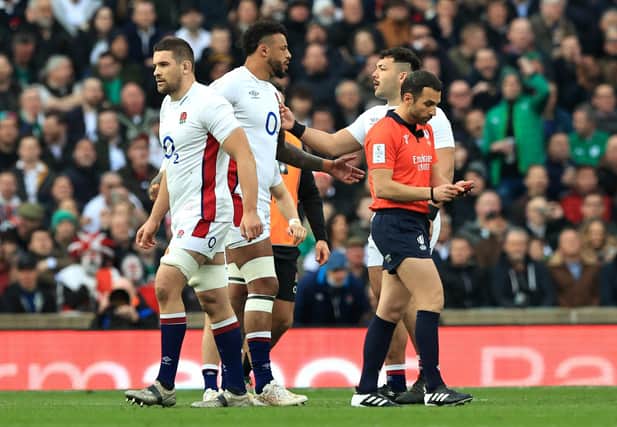 Charlie Ewels of England leaves the field after being shown a red card within the first minute of a match against Ireland.