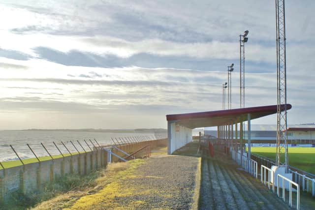 Unsuspecting wingers can find themselves soaked by a freak wave from the North Sea at Arbroath FC's Gayfield Park (Picture: Laurence Reade)