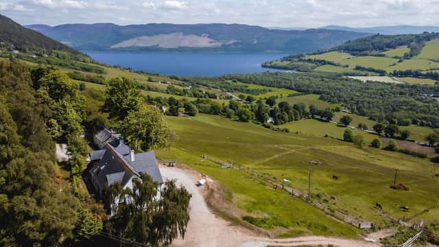 What is it? A contemporary detached family home, plus 19th-Century cottage and equestrian facilities, all overlooking the village of Drumnadrochit and Loch Ness.