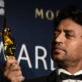 Best Actor winner Irrfan Khan poses with his trophy during the Asian Film Awards in Macau. Acclaimed Indian actor Irrfan Khan, whose international movie career included hits like "Slumdog Millionaire", "Life of Pi" and "The Amazing Spider-Man", has died aged just 53