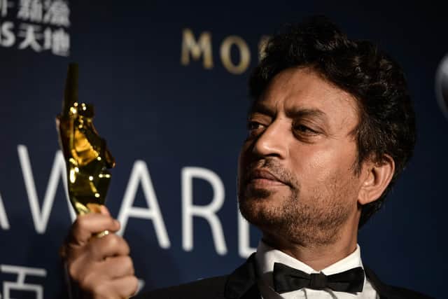 Best Actor winner Irrfan Khan poses with his trophy during the Asian Film Awards in Macau. Acclaimed Indian actor Irrfan Khan, whose international movie career included hits like "Slumdog Millionaire", "Life of Pi" and "The Amazing Spider-Man", has died aged just 53