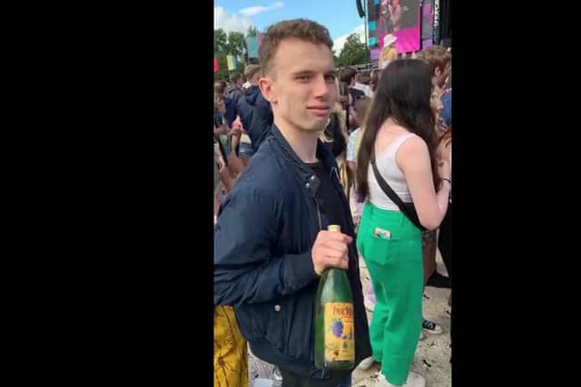 Rory Barraclough holds prized Buckfast bottle at TRNSMT main stage (Photo: Rory Barraclough/ Pure Radio).