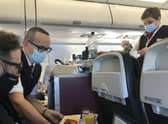 Staff serving food on the first BA holiday flight back to Lisbon.