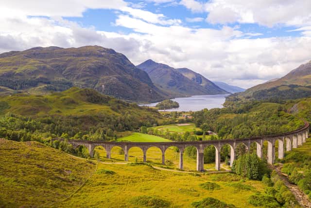 The Jacobite Steam Train is the Harry Potter Express, also called Hogwarts Express, from the Harry Potter film adaptations. The old steam locomotive runs here over the Glenfinnan Viaduct railway viaduct in Scotland. Picture: Getty Images