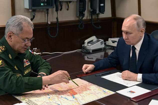 Russia's President Vladimir Putin and Sergei Shoigu, then Russia's defence minister, hold a meeting last year.