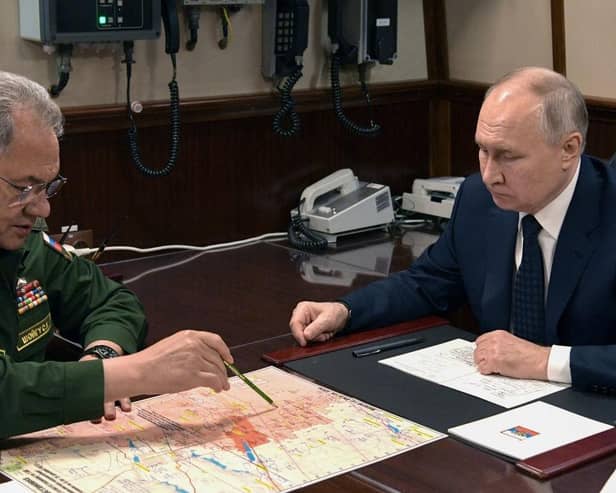 Russia's President Vladimir Putin and Sergei Shoigu, then Russia's defence minister, hold a meeting last year.