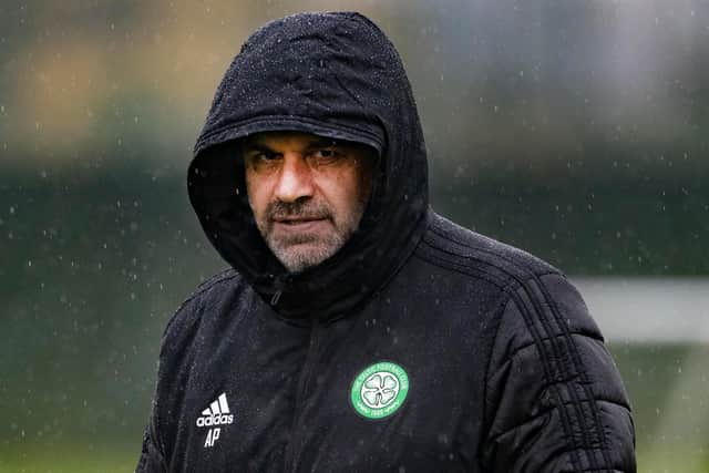 Celtic managerr Ange Postecoglou shields from the rain at the club's Lennoxtown training session on Monday but doesn't seem to want to consider an extra midfield shielder in European games. (Photo by Alan Harvey / SNS Group)