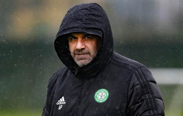Celtic managerr Ange Postecoglou shields from the rain at the club's Lennoxtown training session on Monday but doesn't seem to want to consider an extra midfield shielder in European games. (Photo by Alan Harvey / SNS Group)