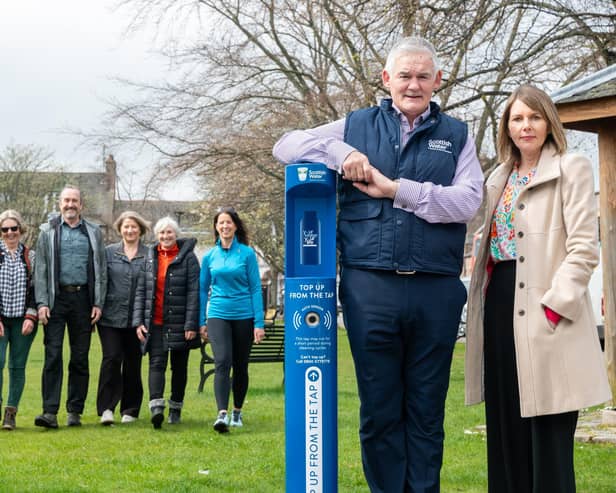 Ballater Walking Festival committee, and Richard & Jo from Ballater & Crathie Community Council, with Scottish Water's Chief Operating Officer Peter Farrer and Cllr Sarah Brown. (Pic: Michael Traill)