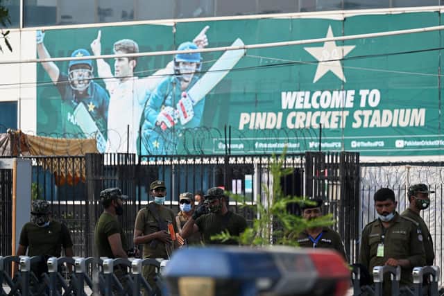 Policemen stand guard outside the Rawalpindi Cricket Stadium in Rawalpindi after New Zealand postponed a series of one-day international (ODI) cricket matches against Pakistan over security concerns. Now England have followed suit. (Photo by AAMIR QURESHI/AFP via Getty Images)