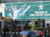 Policemen stand guard outside the Rawalpindi Cricket Stadium in Rawalpindi after New Zealand postponed a series of one-day international (ODI) cricket matches against Pakistan over security concerns. Now England have followed suit. (Photo by AAMIR QURESHI/AFP via Getty Images)