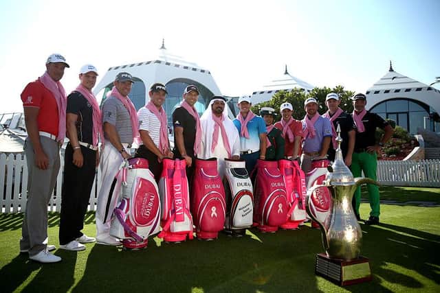 Stephen Gallacher, second right, joins a host of stars in waering pink scarfs supporting breast cancer awareness before teeing off in the Challenge Match ahead of the 2015 Omega Dubai Desert Classic. Picture: Warren Little/Getty Images.