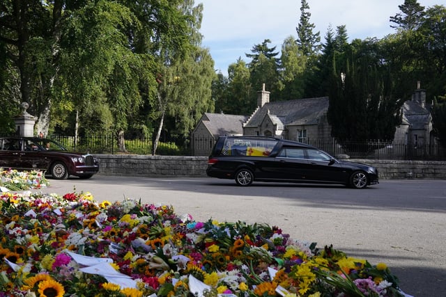 The hearse carrying the coffin of Queen Elizabeth II is draped with the Royal Standard of Scotland (Pic: PA/Owen Humphreys)
