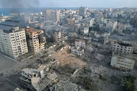 This aerial photo show heavily damaged buildings following Israeli airstrikes in Gaza City (Photo by BELAL AL SABBAGH / AFP)