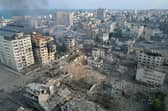 This aerial photo show heavily damaged buildings following Israeli airstrikes in Gaza City (Photo by BELAL AL SABBAGH / AFP)