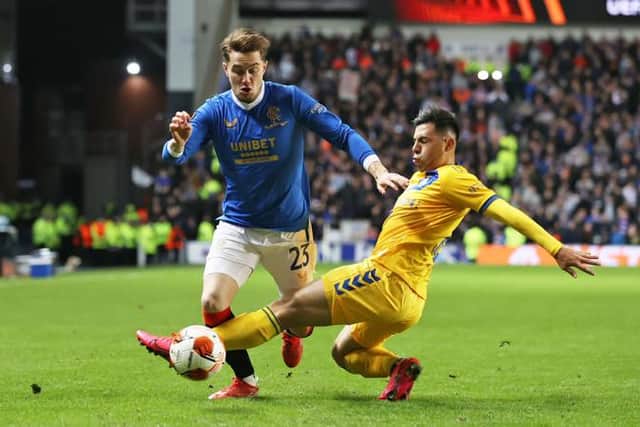 Rangers' Scott Wright (left) skips away from Brondby's Blas Riveros during the UEFA Europa League match between Rangers and Brondby at Ibrox Stadium on October 21, 2021, in Glasgow, Scotland. (Photo by Craig Williamson / SNS Group)