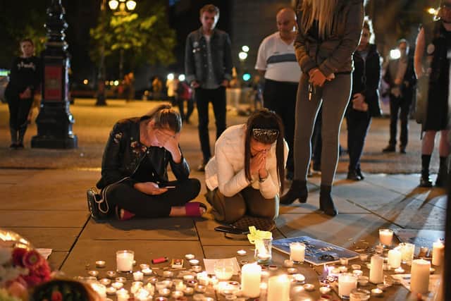A candlelit vigil is held the day after a terrorist attack at the Manchester Arena in May 2017 (Picture: Jeff J Mitchell/Getty Images)