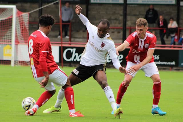 Julian Wade up against Seth Patrick and Kevin McHattie (Photo: Ian Rennie)