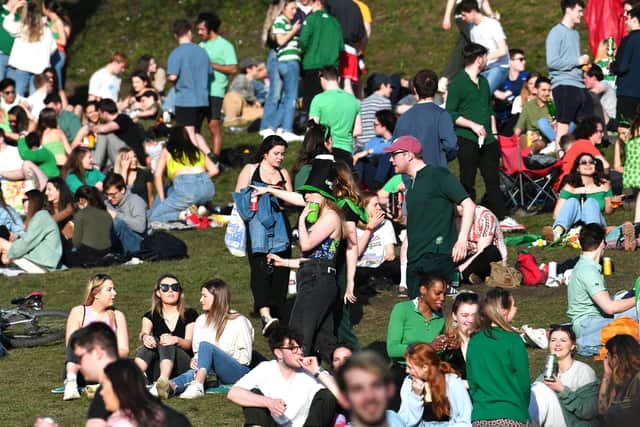Young people congregate to celebrate St Patrick's Day in Kelvingrove Park in Glasgow.