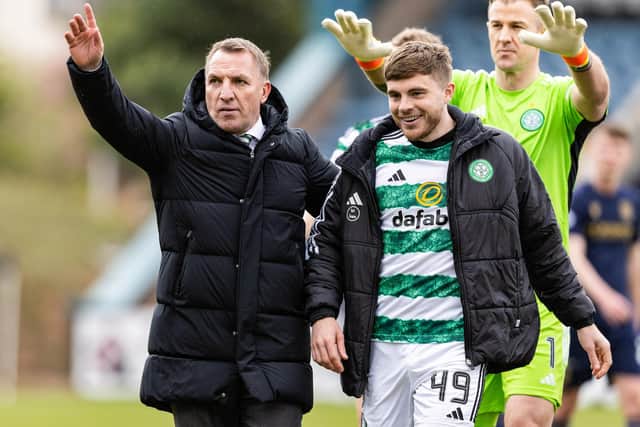 Rodgers with James Forrest at full time during a cinch Premiership match between Dundee and Celtic.