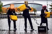 Activists from campaign group Ocean Rebellion pour fake oil in front of the COP26 venue in Glasgow, ahead of the start of the global climate summit. Picture: Andy Buchanan/Getty Images