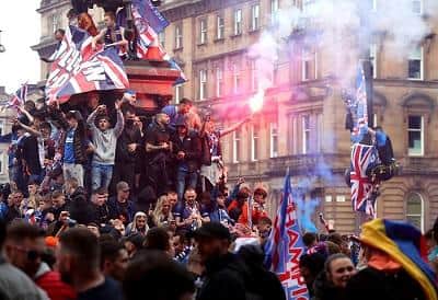 Five police officers were injured during the unrest in Glasgow's George Square as Rangers fans celebrated winning the Scottish Premiership title. Picture: Andrew Milligan/PA