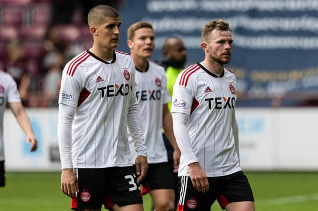 Aberdeen's Slobodan Rubezic and Nicky Devlin look dejected at full time after the 2-0 defeat by Hearts.