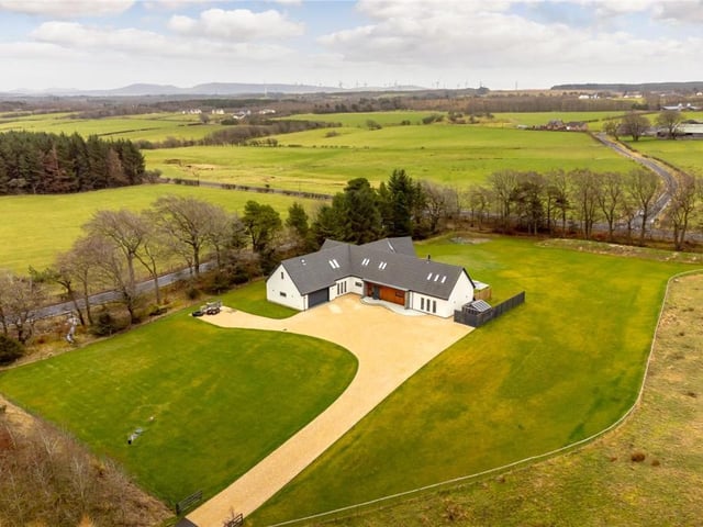Aerial view of property and grounds.