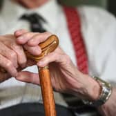An elderly man holding a walking stick. Social workers in Scotland were forced to miss more than 30,000 days of work because of mental health issues in the last year, figures have shown. Picture: Joe Giddens/PA Wire